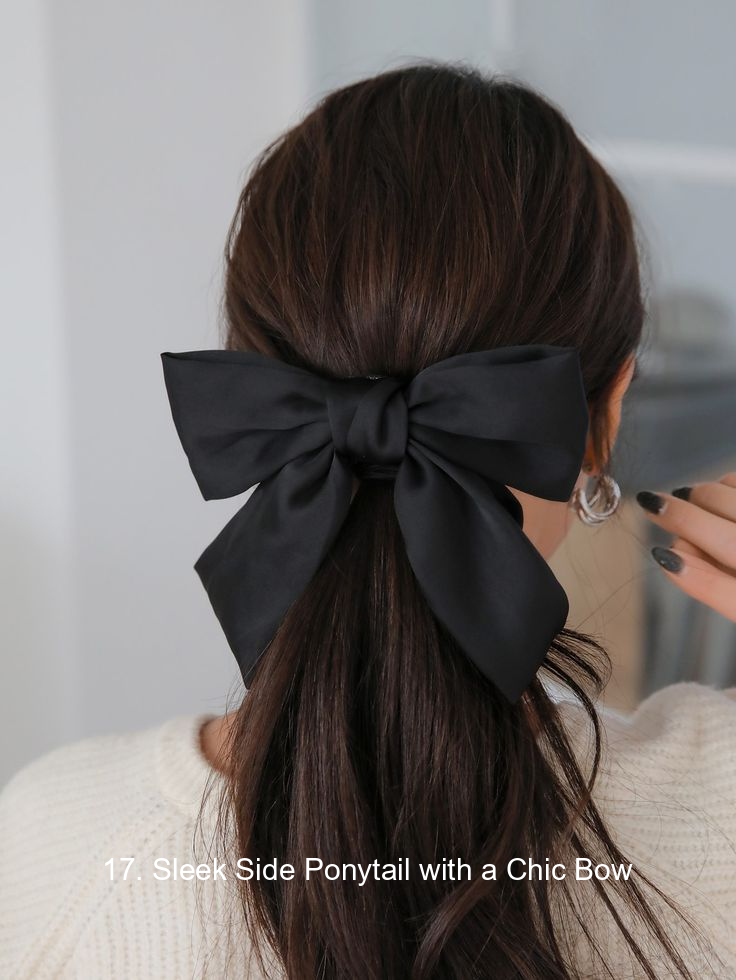 17. Sleek Side Ponytail with a Chic Bow