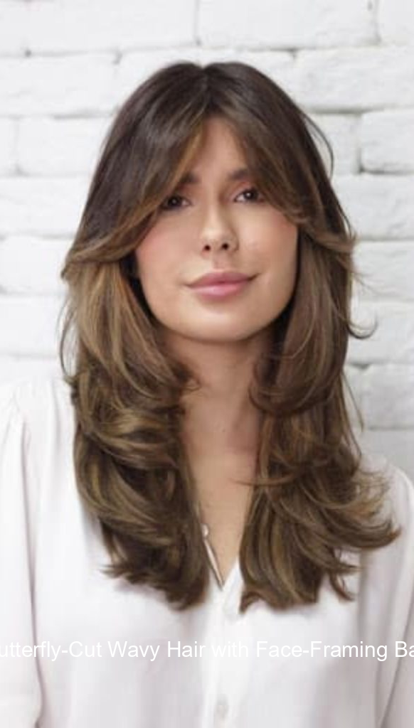 2. Butterfly-Cut Wavy Hair with Face-Framing Bangs