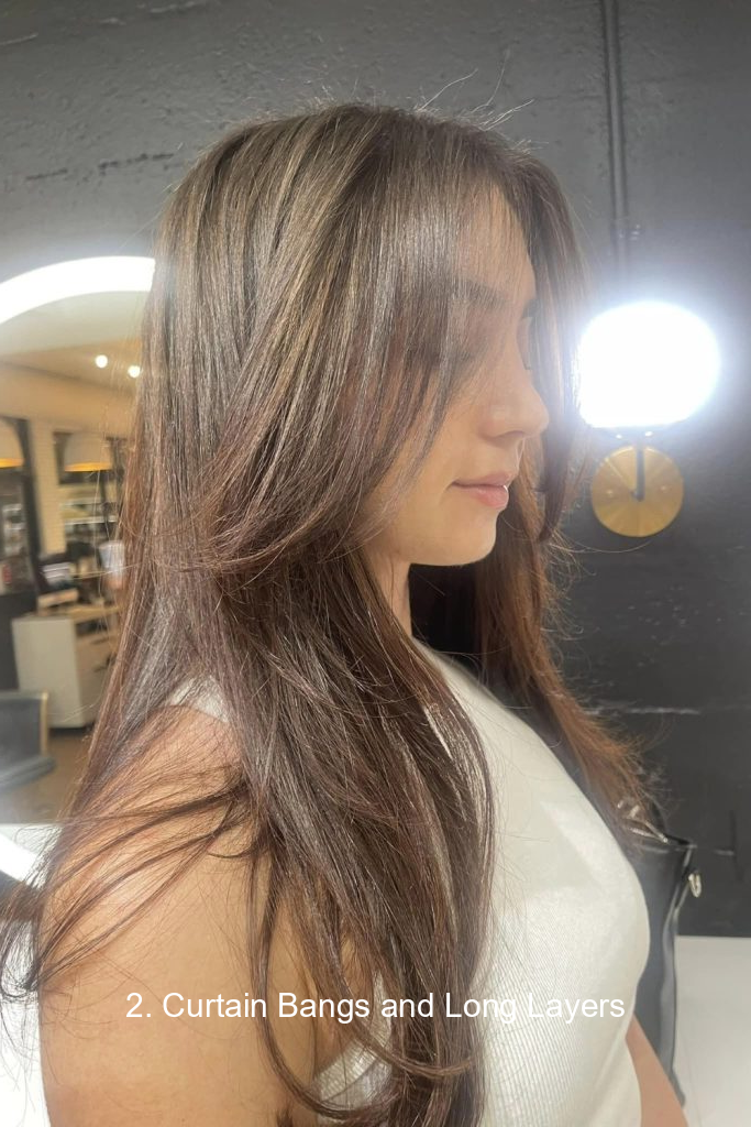 2. Curtain Bangs and Long Layers