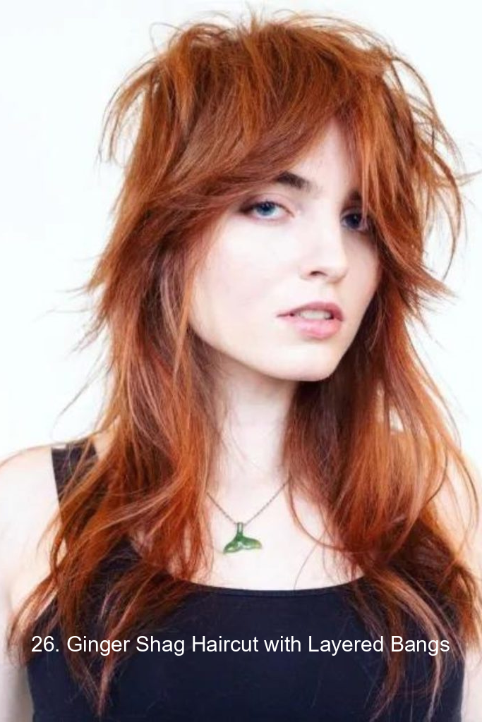 26. Ginger Shag Haircut with Layered Bangs