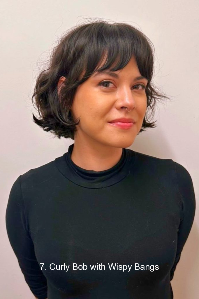 7. Curly Bob with Wispy Bangs